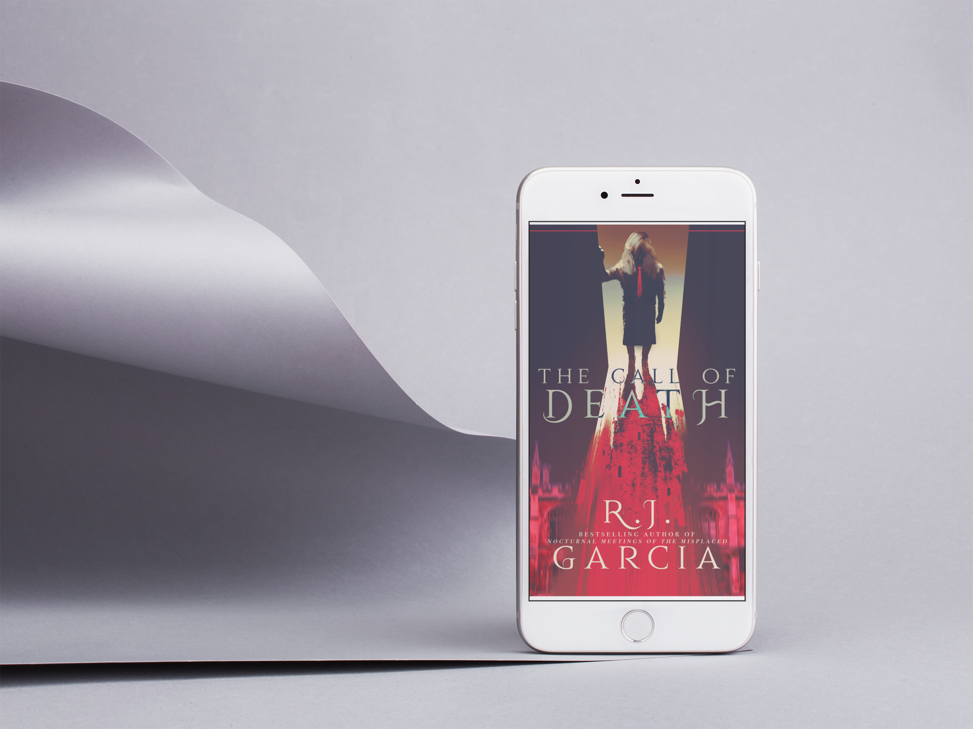 silver-iphone-8-mockup-standing-by-a-silver-pasteboard-in-a-gray-room-22192